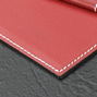 close up of leather red desk pad